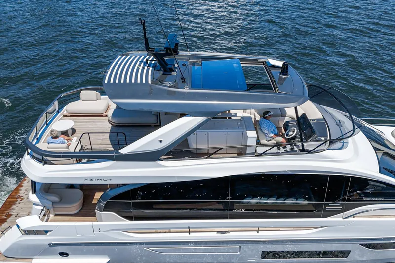 Slide: The Image of Luxury 2026 Azimut Fly 72 yacht cruising on open water, featuring spacious deck and modern design. - 25