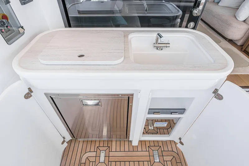 Slide: The Image of Modern kitchenette on 2026 Azimut Fly 72 yacht with sink and storage. - 40