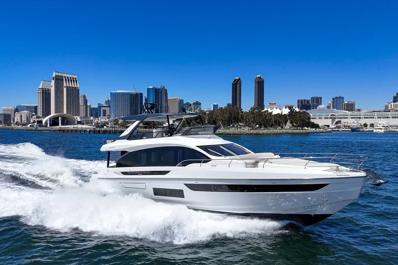 Slide: The Image of 2026 Azimut Fly 72 yacht cruising near city skyline on a sunny day. - 5