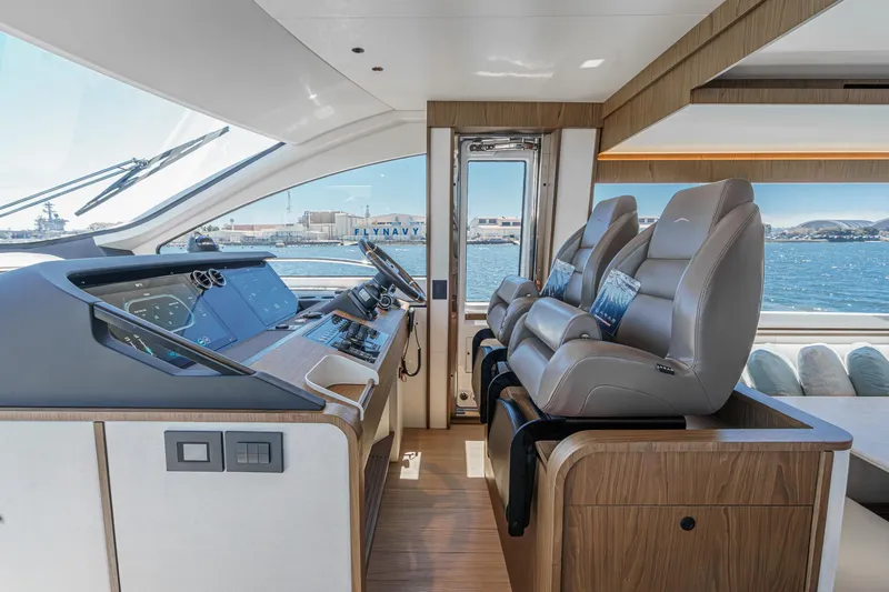Slide: The Image of Luxurious interior of 2026 Azimut Fly 72 yacht with modern helm and plush seating. - 50