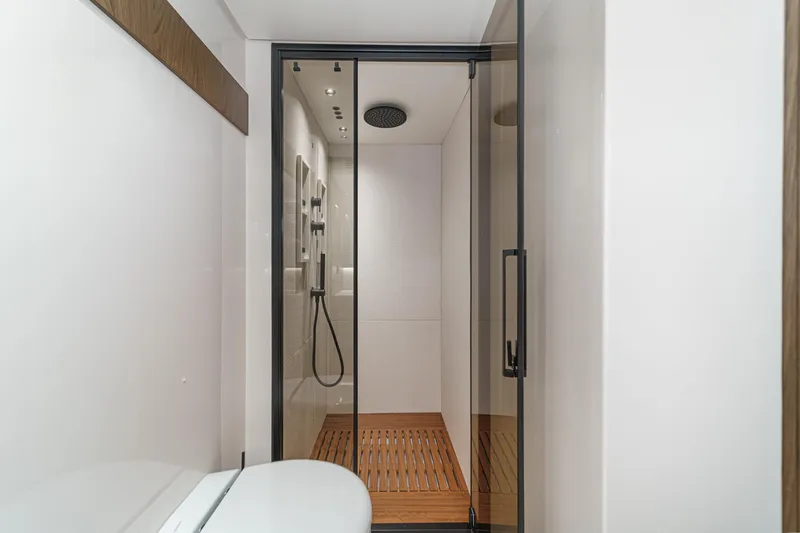 Slide: The Image of Luxurious shower in 2026 Azimut Fly 72 yacht with modern design and wooden flooring. - 59