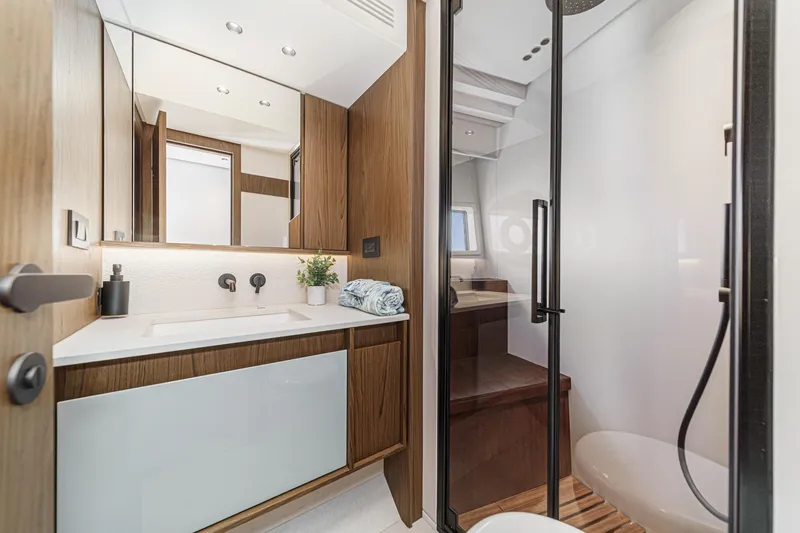 Slide: The Image of Luxurious bathroom in 2026 Azimut Fly 72 yacht with modern fixtures and wooden accents. - 66