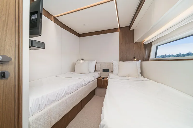 Slide: The Image of Luxurious twin cabin interior on 2026 Azimut Fly 72 yacht, featuring modern design and comfort. - 68