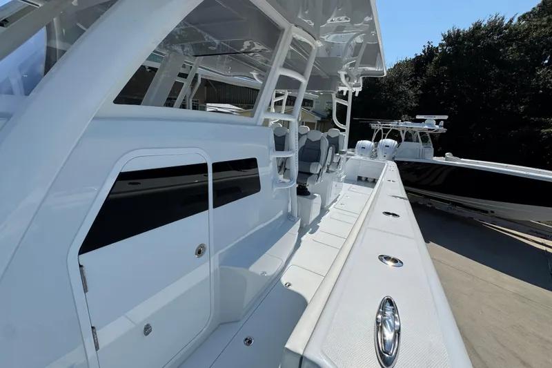 Slide: The Image of 2026 Invincible 46 Catamaran with sleek design and modern seating on deck. - 25