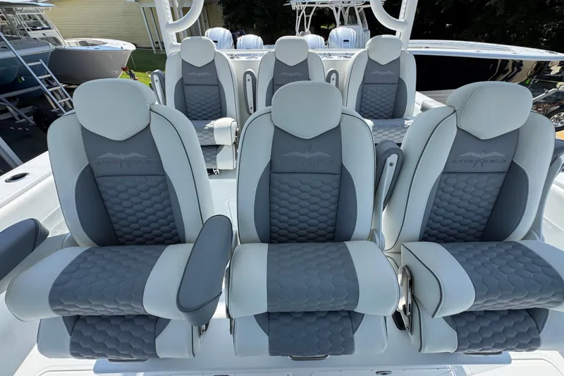 Slide: The Image of Luxurious seating on 2026 Invincible 46 Catamaran, featuring gray and white cushioned design. - 31
