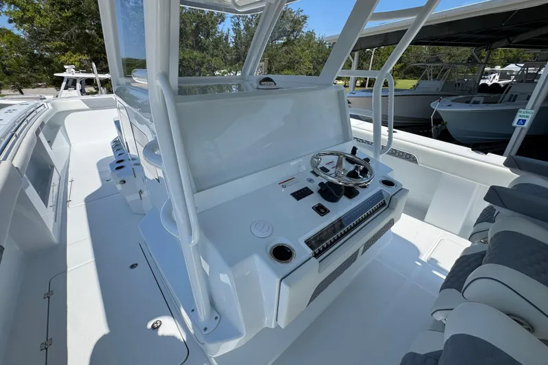 Slide: The Image of 2026 Invincible 46 Catamaran cockpit with modern steering console and seating. - 33