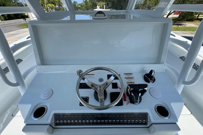 Slide: The Image of Helm of 2026 Invincible 46 Catamaran featuring modern controls and steering wheel. - 34