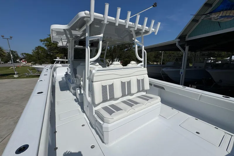 Slide: The Image of 2026 Invincible 46 Catamaran with sleek white seating and modern design. - 41