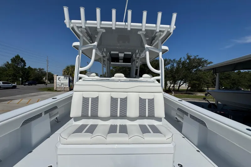 Slide: The Image of 2026 Invincible 46 Catamaran with sleek seating and modern design under clear blue sky. - 42