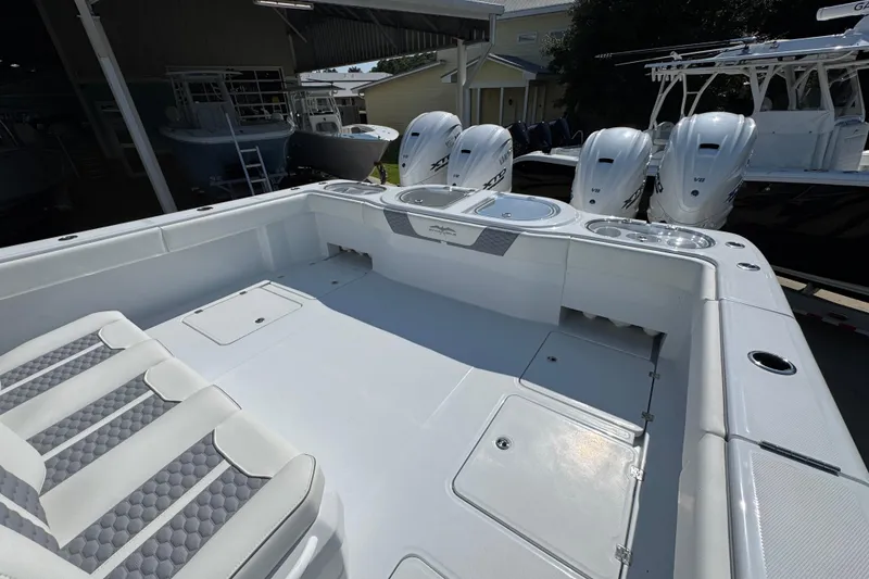 Slide: The Image of 2026 Invincible 46 Catamaran with spacious deck and powerful outboard engines. - 44