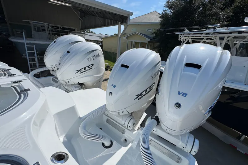 Slide: The Image of 2026 Invincible 46 Catamaran with Yamaha XTO V8 outboard engines in a marina setting. - 50