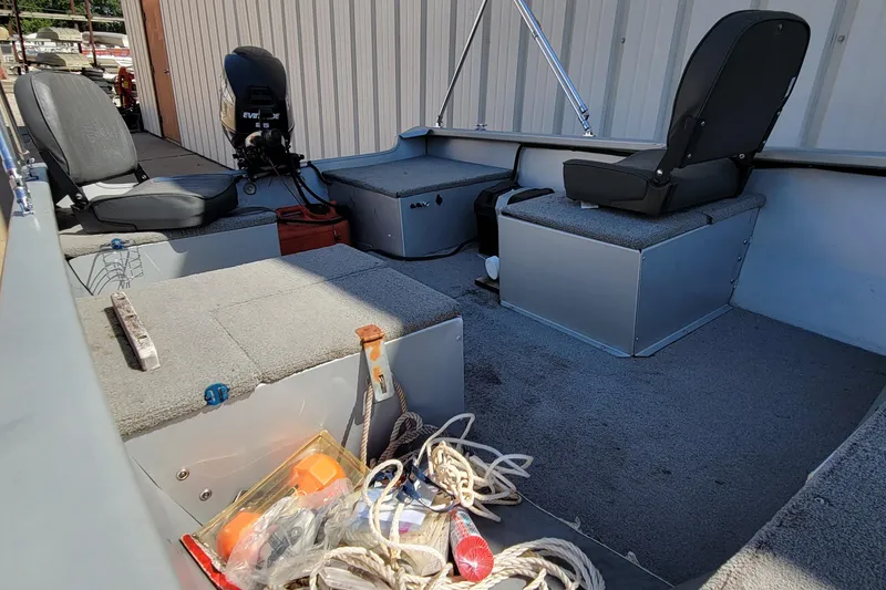 Slide: The Image of 2010 Tracker Guide V 15 Laker boat interior with seats and equipment. - 16