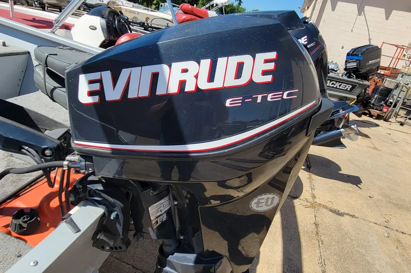 Slide: The Image of Evinrude E-TEC outboard motor on 2010 Tracker Guide V 15 Laker boat. - 3