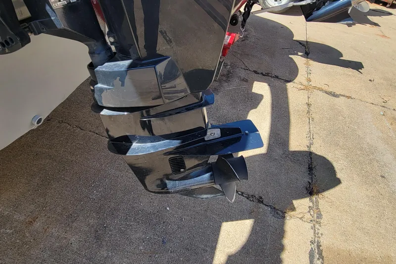 Slide: The Image of 2010 Tracker Guide V 15 Laker boat motor on concrete surface. - 6