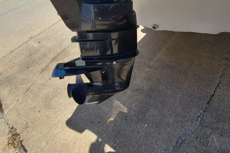 Slide: The Image of 2010 Tracker Guide V 15 Laker boat motor on concrete surface. - 7