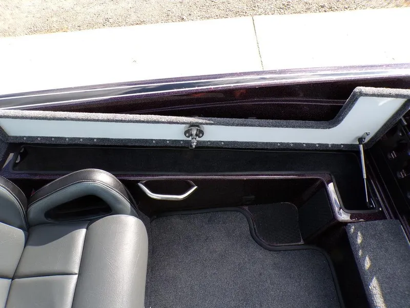 Slide: The Image of Interior view of a 2025 Phoenix 721 ZXL boat, featuring seating and storage compartments. - 22