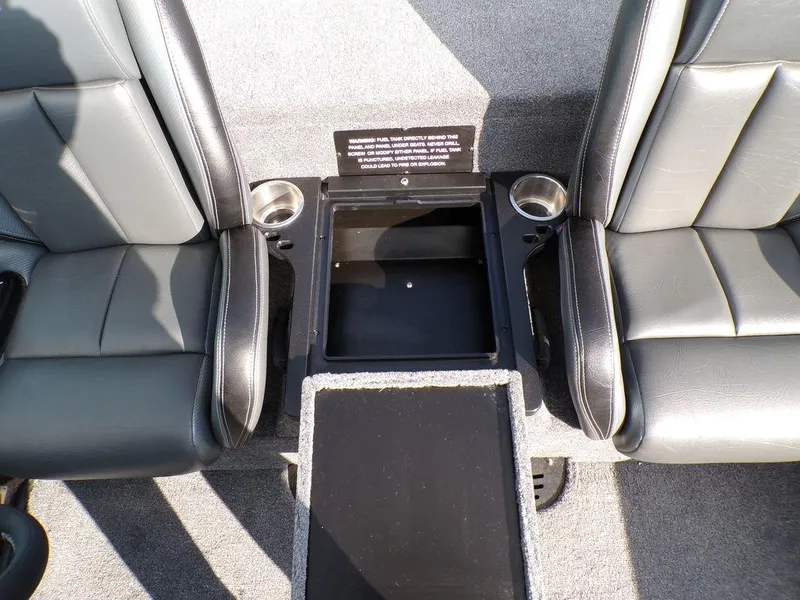 Slide: The Image of Interior of 2025 Phoenix 721 ZXL boat with black seats and storage compartment. - 23