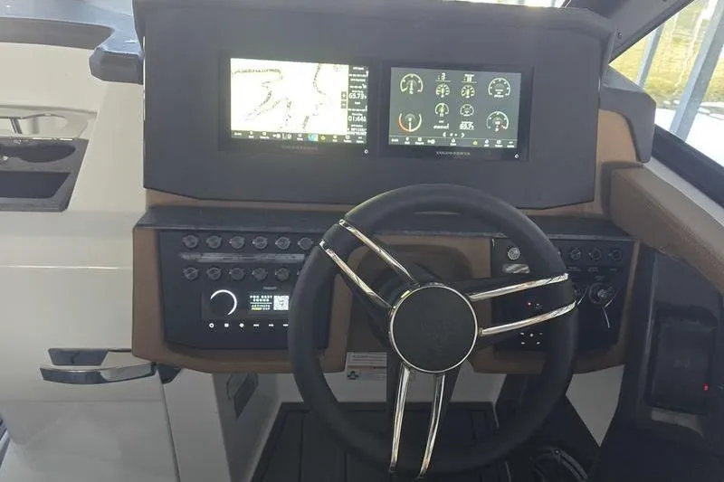 Slide: The Image of Steering console of 2026 Cobalt R31 with dual display screens and control panel. - 10