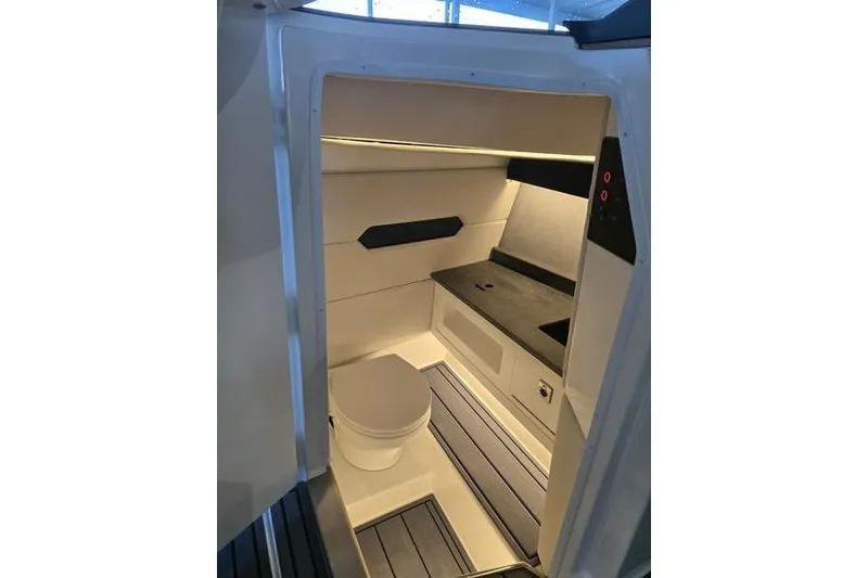 Slide: The Image of 2026 Cobalt R31 boat interior with modern bathroom and seating area. - 5