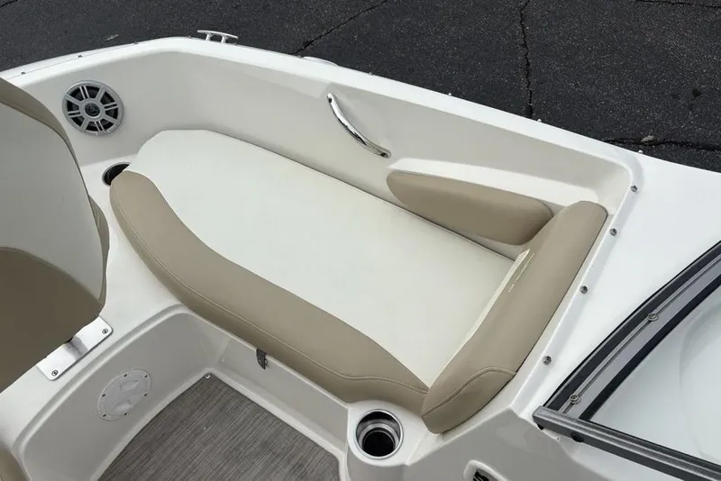 Slide: The Image of 2017 Stingray 191DC O/B boat interior with beige seating and speaker. - 13