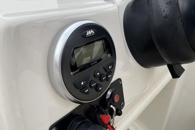 Slide: The Image of 2017 Stingray 191DC O/B boat dashboard with marine audio system and controls. - 24