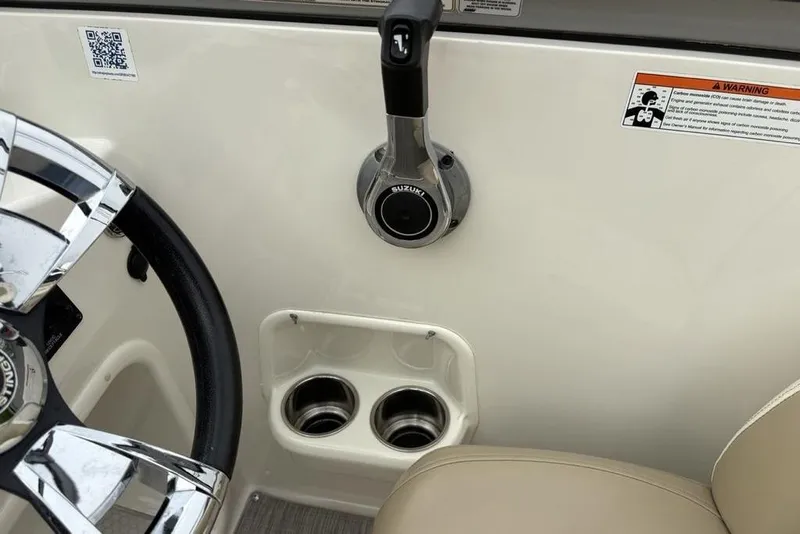Slide: The Image of 2017 Stingray 191DC O/B boat interior with steering wheel and throttle controls. - 27