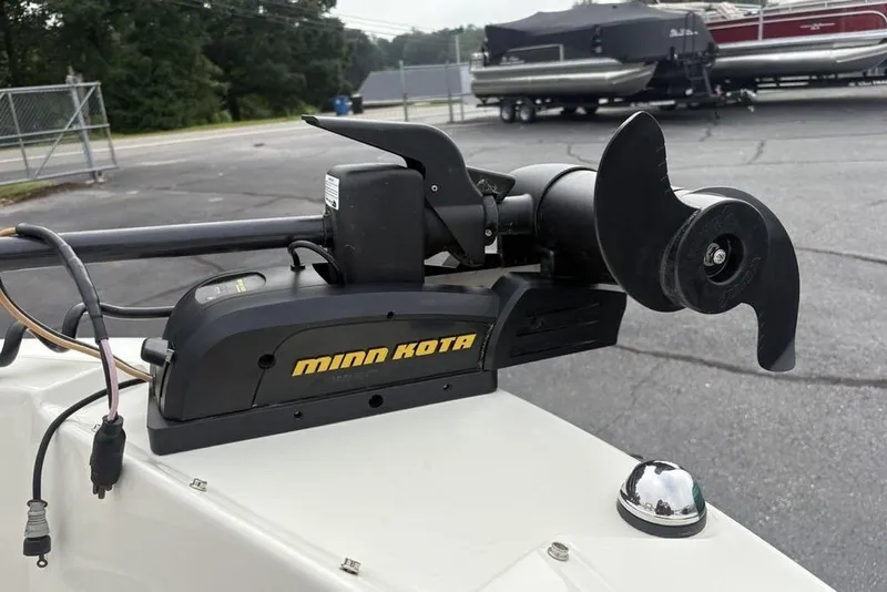 Slide: The Image of Minn Kota trolling motor on 2017 Stingray 191DC O/B boat, parked outdoors. - 3