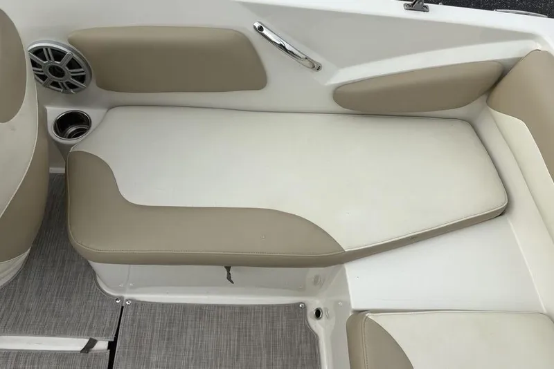 Slide: The Image of 2017 Stingray 191DC O/B boat interior with beige and white seating. - 31