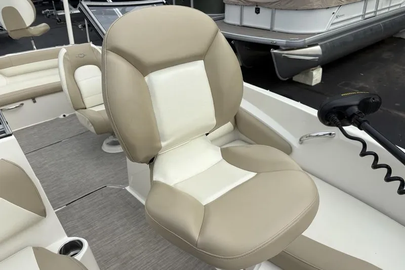 Slide: The Image of 2017 Stingray 191DC O/B boat interior with beige and white seating. - 5