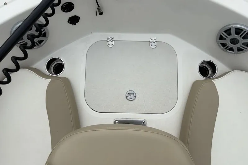 Slide: The Image of 2017 Stingray 191DC O/B boat interior with beige seating and cup holders. - 7