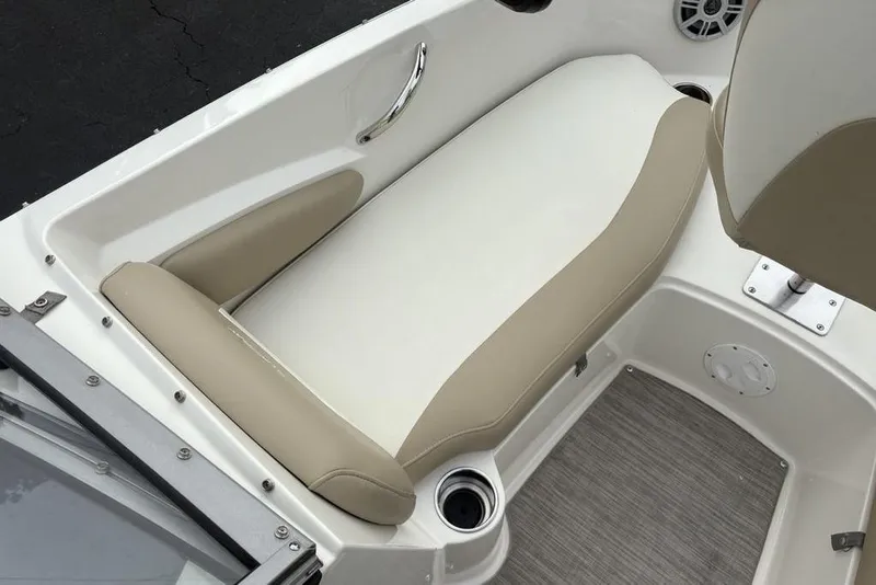 Slide: The Image of 2017 Stingray 191DC O/B boat interior with beige and white seating. - 9