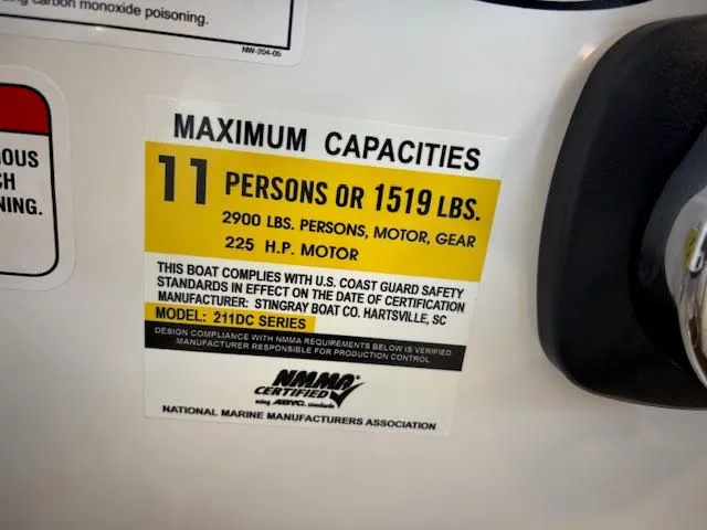 Slide: The Image of Maximum capacity label for Stingray 211DC boat, 2026 model, 11 persons or 1519 lbs. - 12