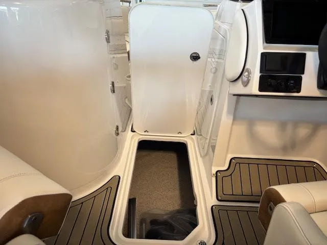 Slide: The Image of Interior view of 2026 Stingray 211DC boat, featuring sleek design and modern amenities. - 14