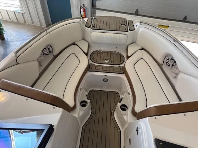 Slide: The Image of 2026 Stingray 211DC boat interior with white seating and wood accents. - 17