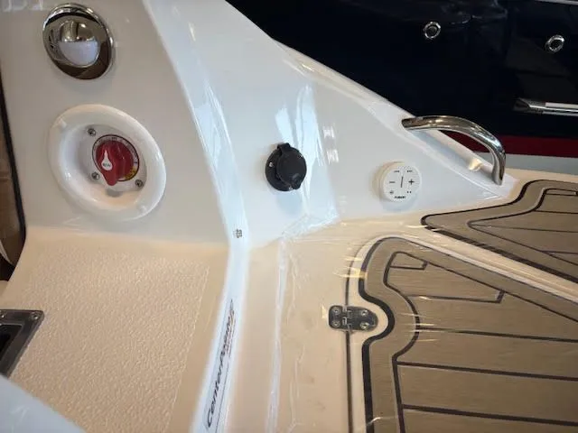 Slide: The Image of 2026 Stingray 211DC boat interior, featuring control panel and sleek design elements. - 7