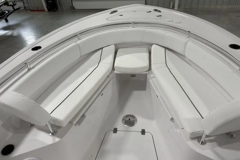 Slide: The Image of 2026 Sportsman Open 232 Center Console boat with white cushioned seating. - 13