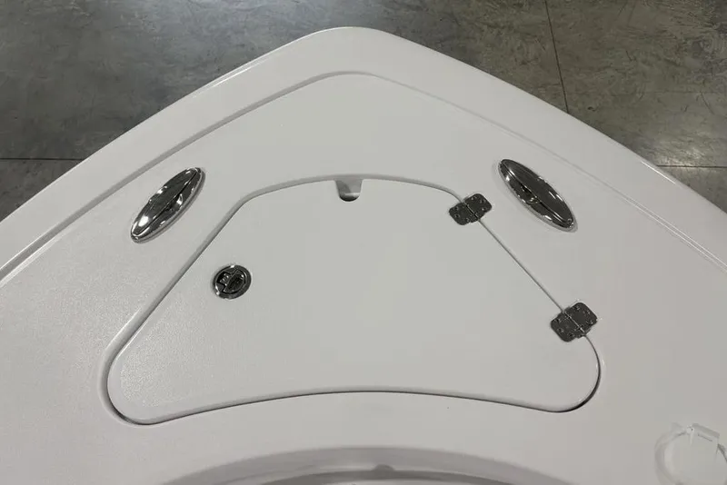 Slide: The Image of 2026 Sportsman Open 232 Center Console boat deck with storage hatch and cleats. - 14