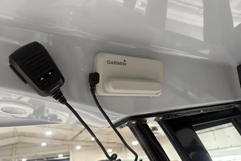 Slide: The Image of 2026 Sportsman Open 232 Center Console with Garmin marine electronics and communication device. - 17