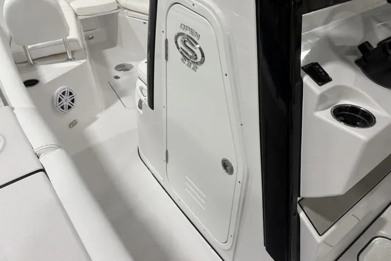 Slide: The Image of 2026 Sportsman Open 232 Center Console interior, featuring seating and storage compartments. - 19