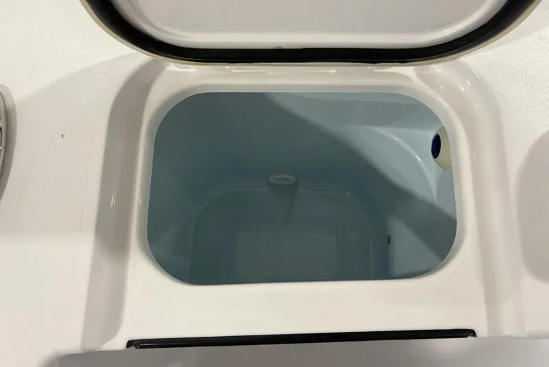 Slide: The Image of Open storage compartment on 2026 Sportsman Open 232 Center Console boat. - 26