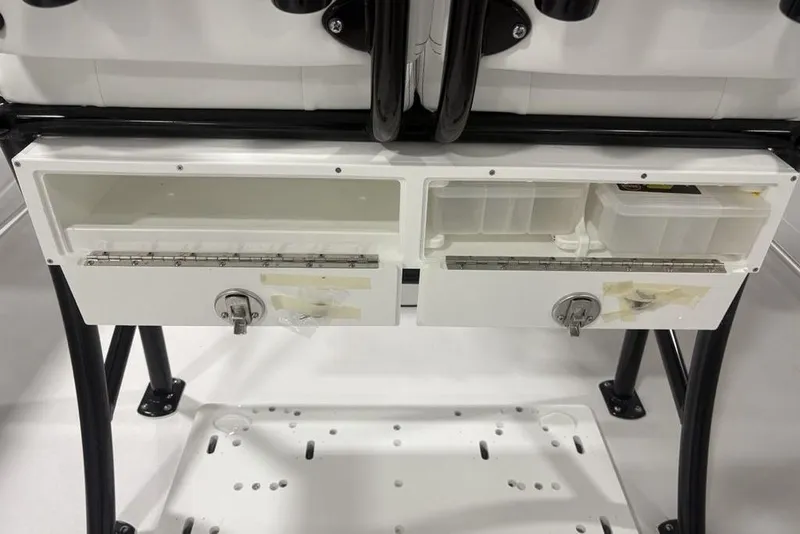 Slide: The Image of Storage compartments on a 2026 Sportsman Open 232 Center Console boat. - 29