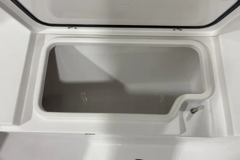 Slide: The Image of Open storage compartment on 2026 Sportsman Open 232 Center Console boat. - 6