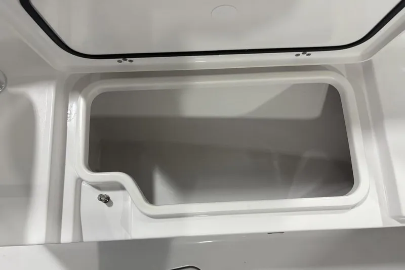 Slide: The Image of Open storage compartment in 2026 Sportsman Open 232 Center Console boat. - 7