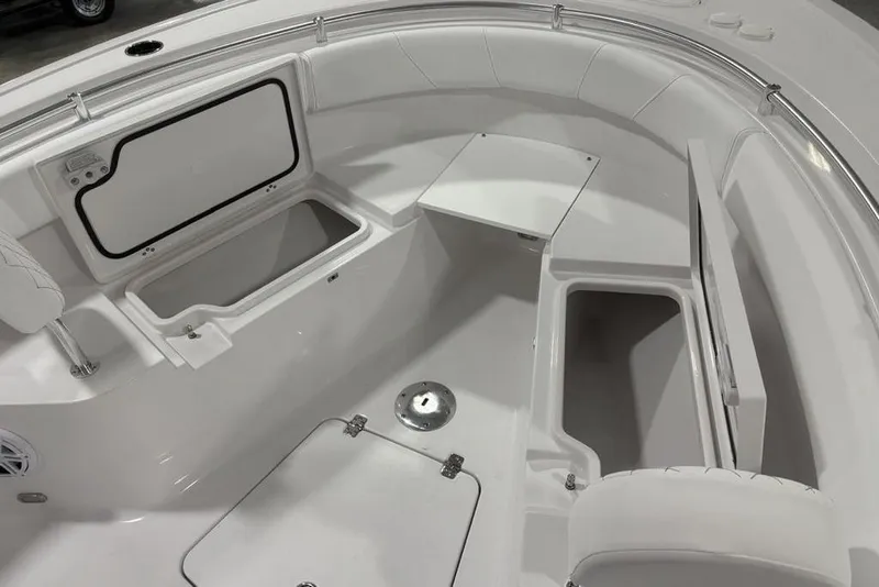 Slide: The Image of 2026 Sportsman Open 232 Center Console boat interior with storage compartments. - 8