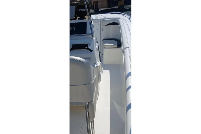 Slide: The Image of 1999 Wellcraft Scarab 302 Sport boat hull with sleek design and vibrant graphics. - 10