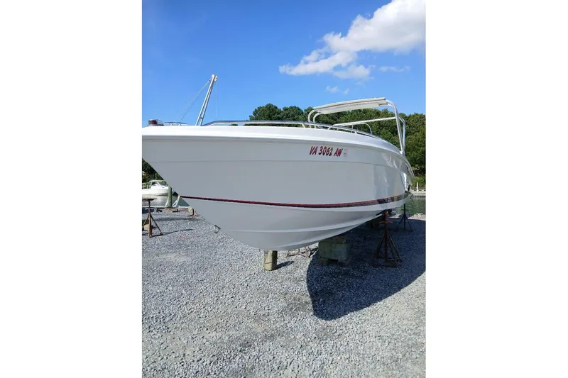 Slide: The Image of 1999 Wellcraft Scarab 302 Sport boat interior with steering console and seating. - 15