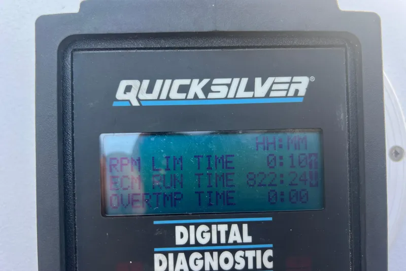 Slide: The Image of Quicksilver digital diagnostic display showing RPM and ECM run time for 1999 Wellcraft 302 Scarab Sport. - 35