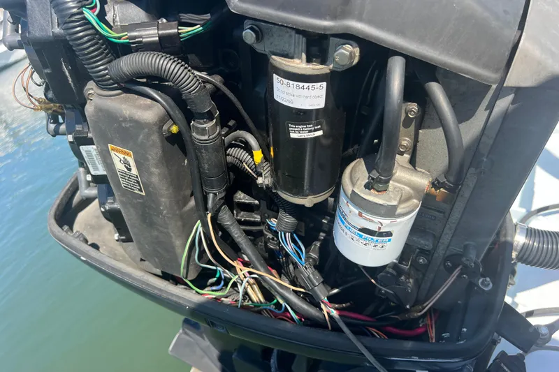 Slide: The Image of Close-up of a 1999 Wellcraft 302 Scarab Sport engine with visible wiring and components. - 41