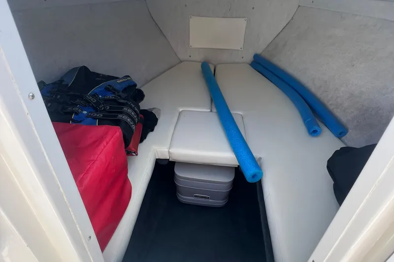 Slide: The Image of Interior cabin of 1999 Wellcraft 302 Scarab Sport with seating and storage. - 51