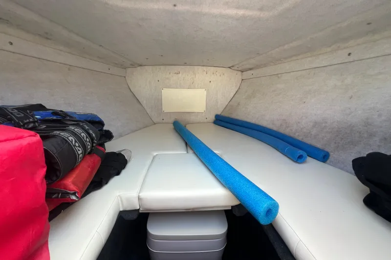 Slide: The Image of Interior cabin of 1999 Wellcraft 302 Scarab Sport with seating and storage. - 55